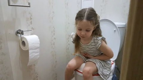 little-girl-sitting-toilet-problem-footage-104405425_iconl.jpeg