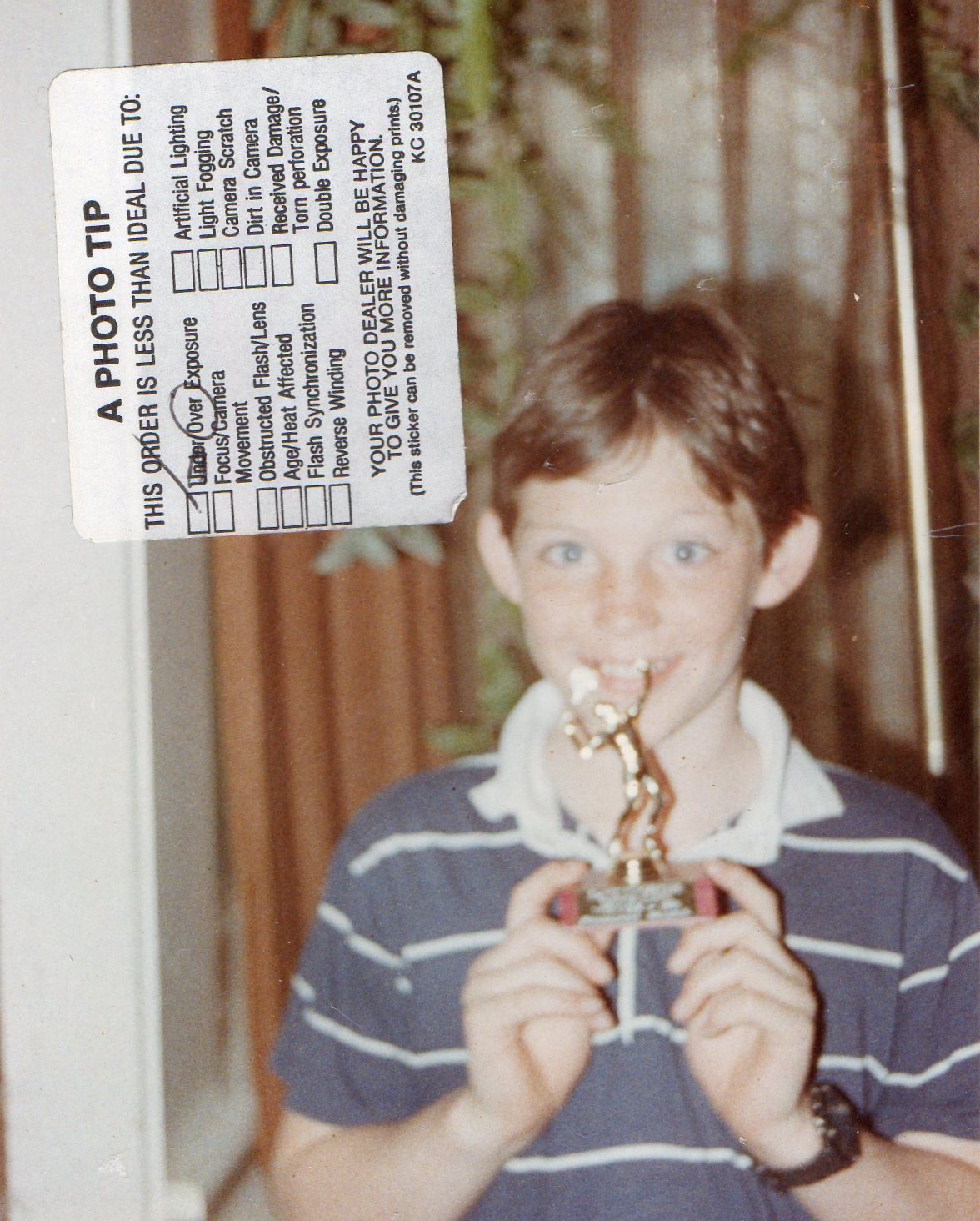 16 Christopher Wright showing off his tennis trophy.jpg